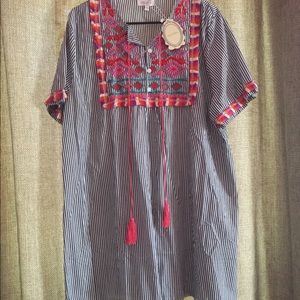 Boutique shirt with tassel detailing!